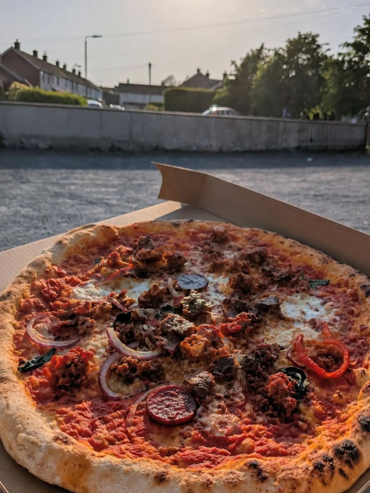 A leopard-spotted pepperoni and 'nduja pizza served at Laurelbank Farm