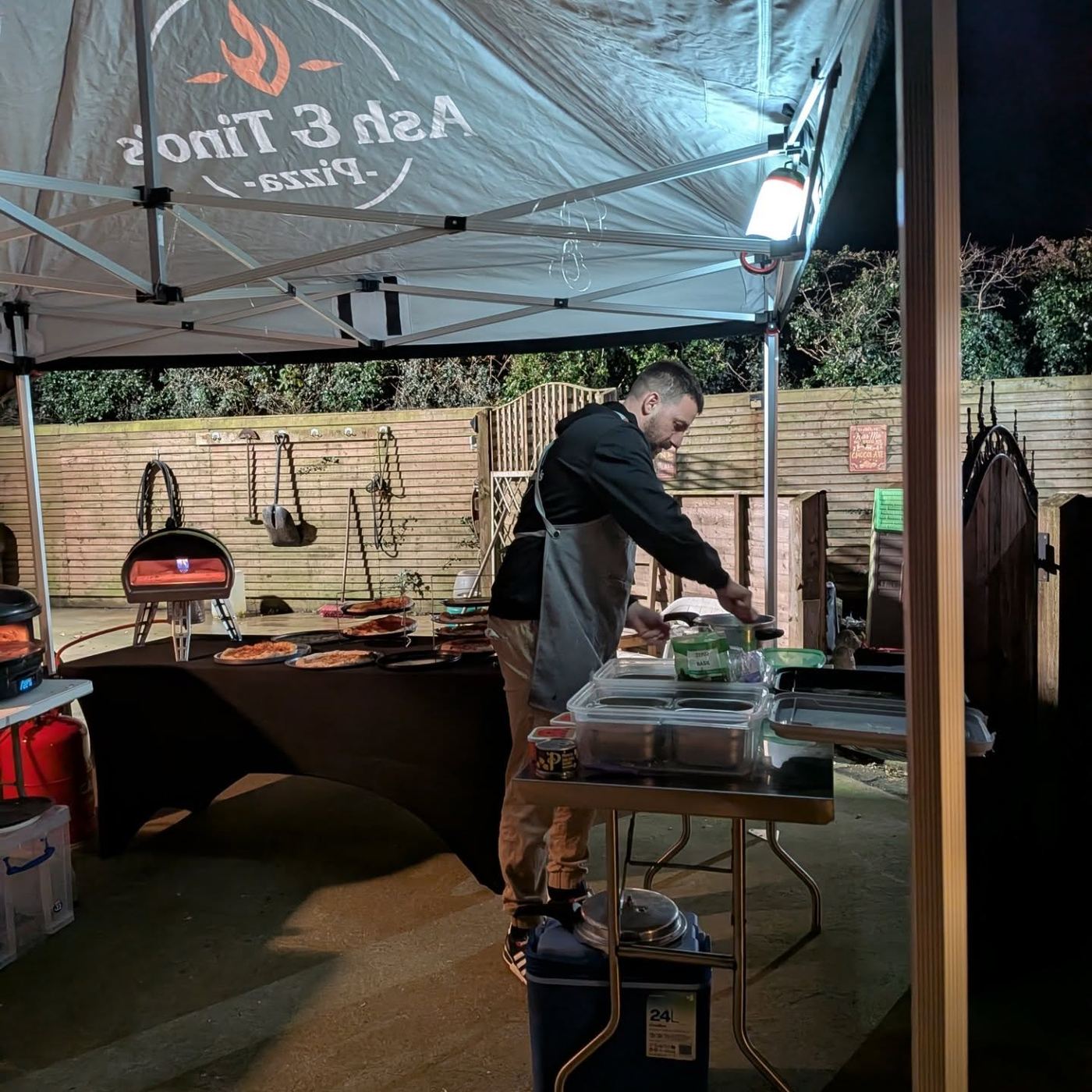 The Ash & Tino's gazebo set up at an evening pop-up
